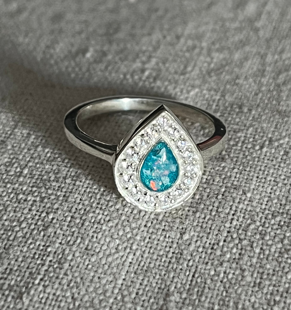 Ashes set in resin pearshaped ring with cz