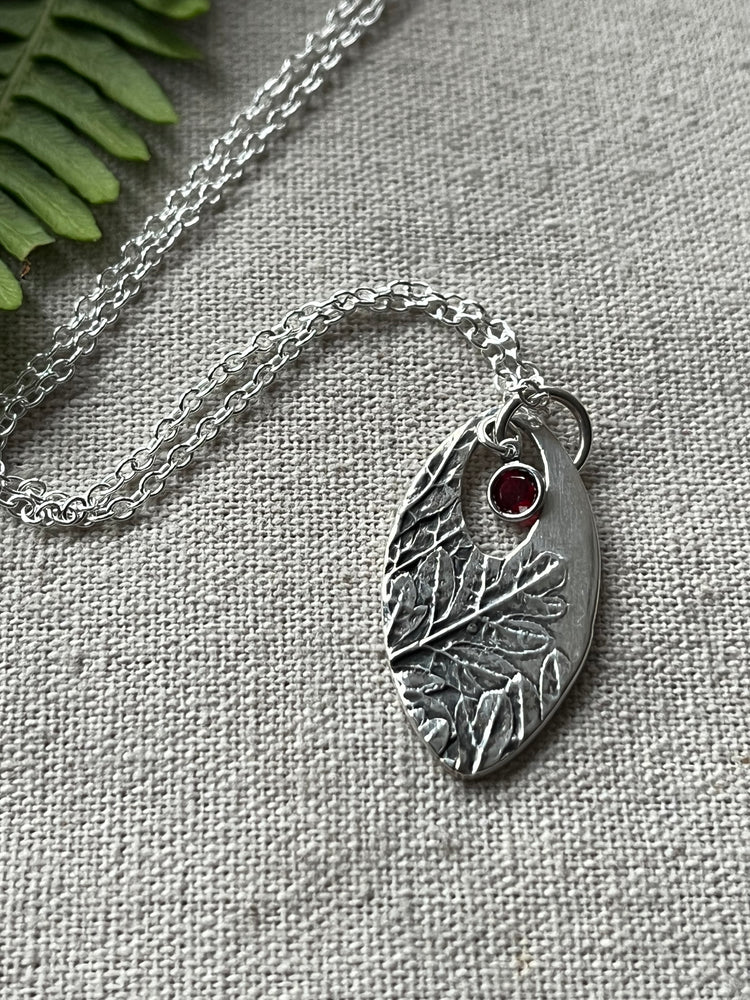 Pointed oval botanical printed silver necklace