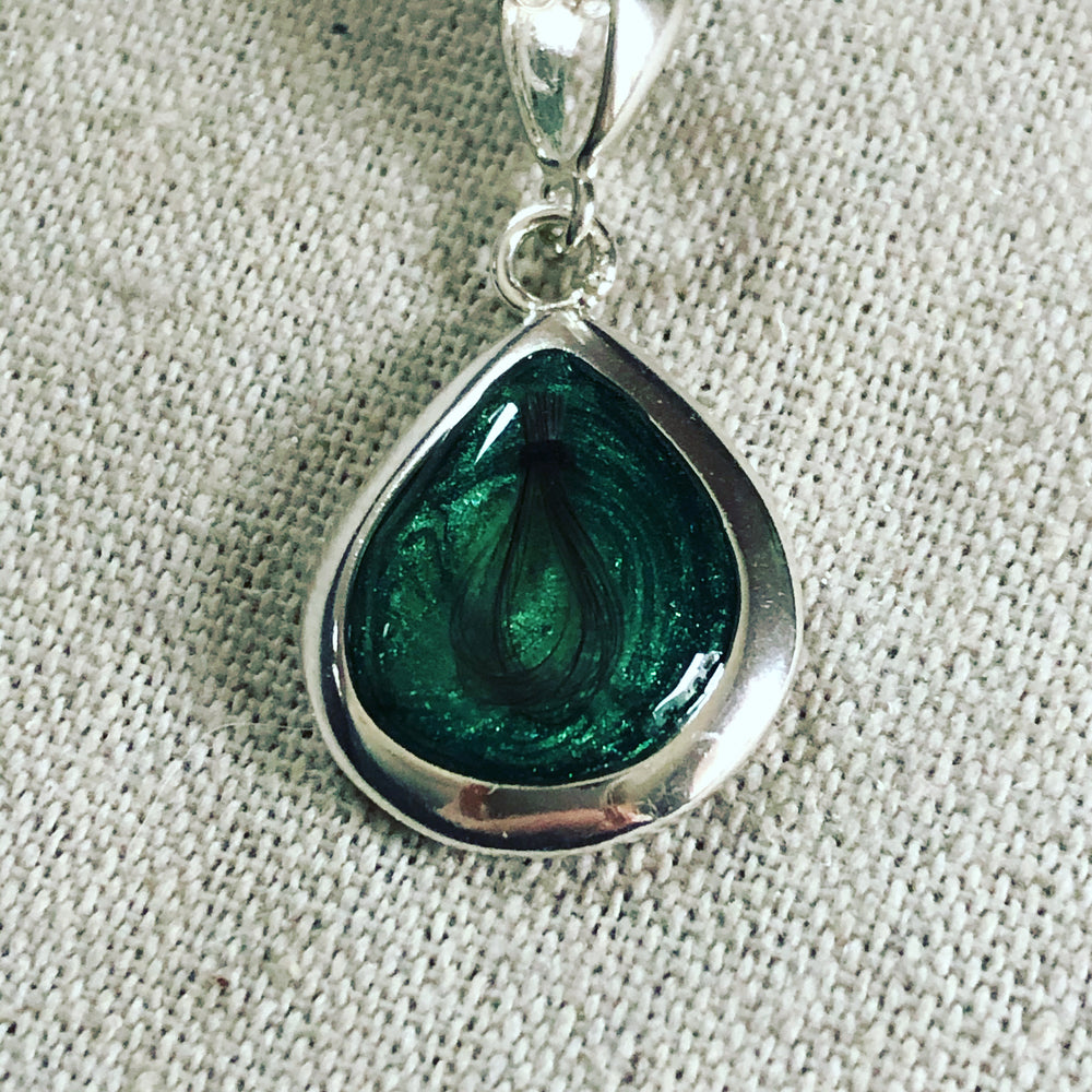 Ashes set in resin teardrop pendant