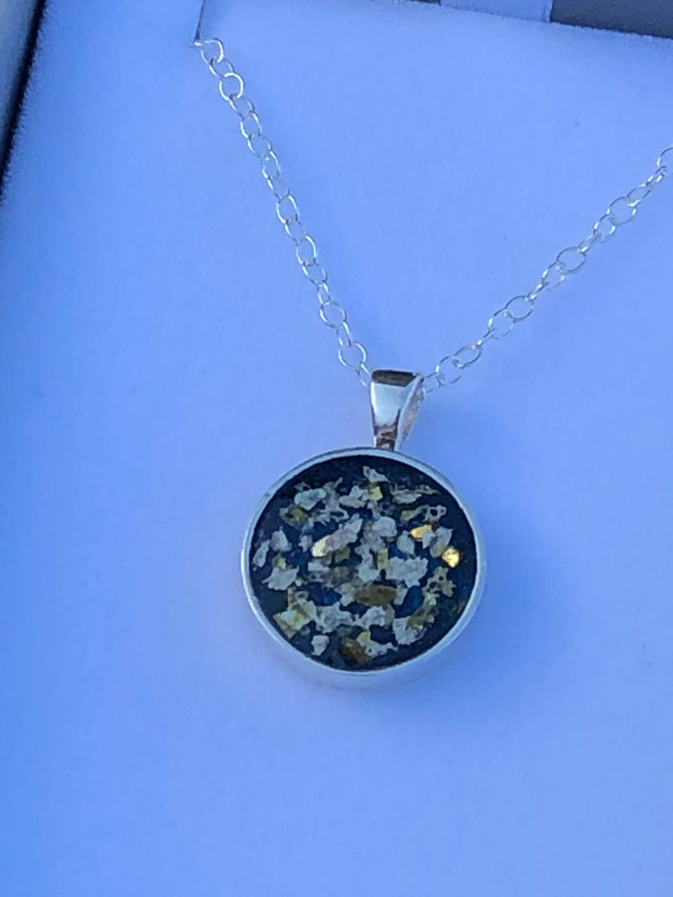 Ashes set in resin round pendant